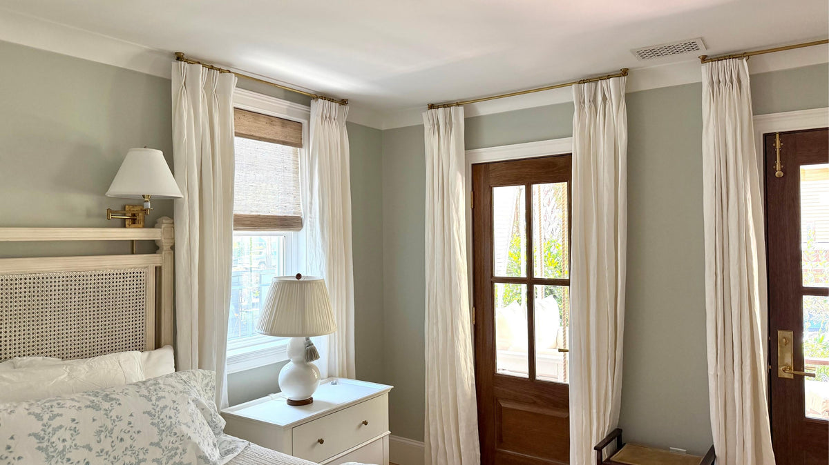 DIY ceiling curtain rod with linen drapes, designed to work around crown molding